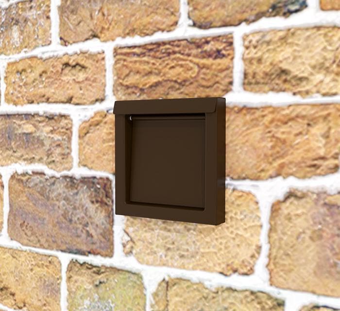 Photo of the brown DryerWallVent installed on a stone wall.